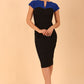 Model wearing the Diva Bryony Contrast dress with contrasting top and exposed zip at the back in black and cobalt blue front image