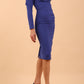 model is wearing diva catwalk cynthia long sleeve pencil dress with low v-neckline in Riviera Blue front