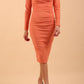 model is wearing diva catwalk cynthia long sleeve pencil dress with low v-neckline in Dusky Coral front