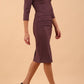 Model wearing the Diva Daphne ¾ Sleeved dress with pleat detail across the hips and ¾ sleeve length in mauve purple front side