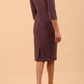 Model wearing the Diva Daphne ¾ Sleeved dress with pleat detail across the hips and ¾ sleeve length in mauve purple back