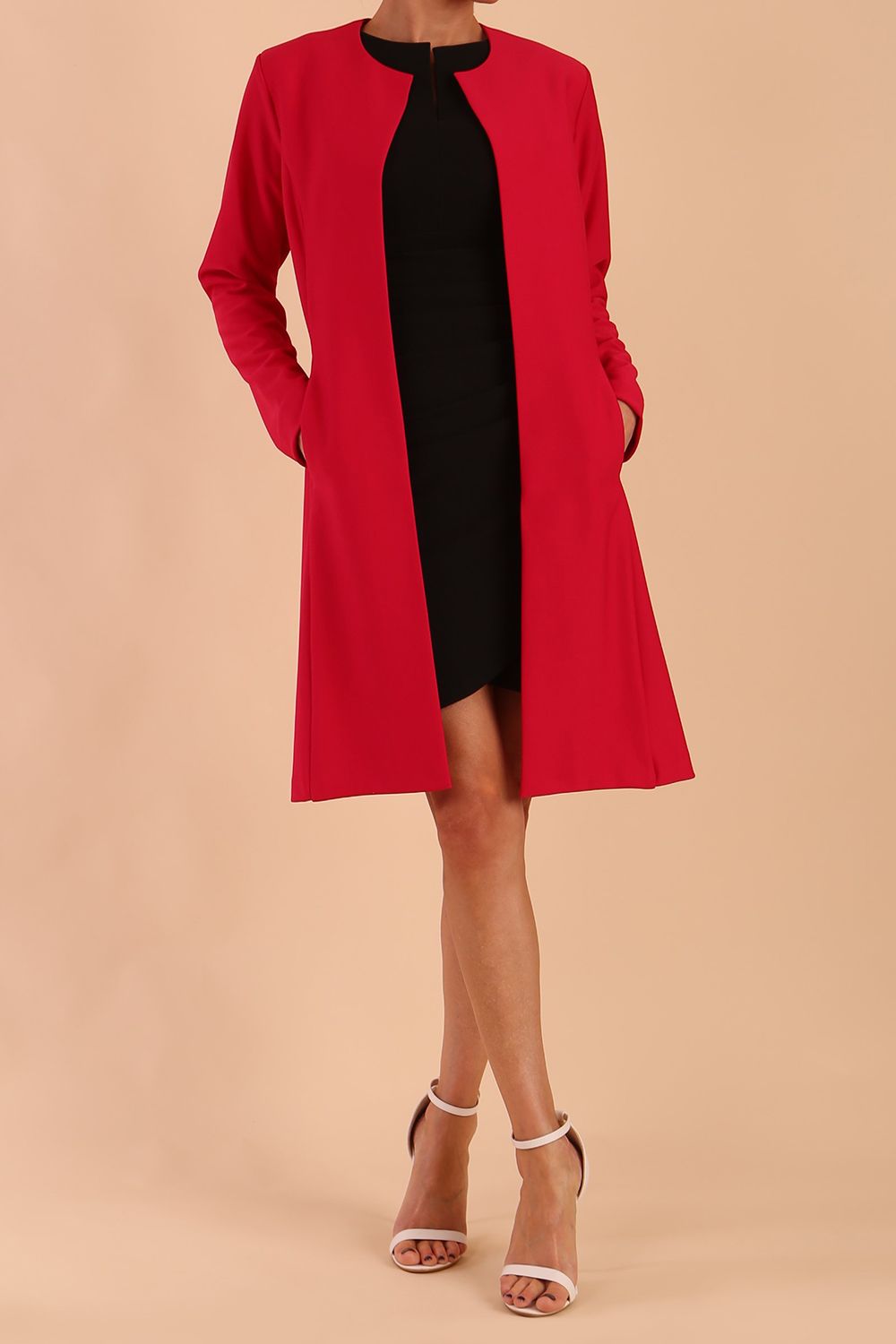 model wearing diva catwalk teal coat with long sleeves and a belt in Rose Red front