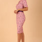 model wearing a diva catwalk Floella Jacquard Dress shor sleeves pencil dress in jacquard fabric in pink lavender with purple waistband contrast colour front side