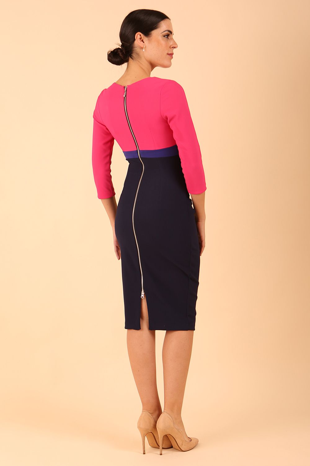 model wearing a diva catwalk Nadia 3/4 Sleeve Colour Block Dress 3/4 sleeve pencil dress exposed zip at the back in Navy blue, Fuchsia Pink and Orient Blue colour back