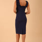 brunette model is wearing diva catwalk odessa pencil sleeveless dress with frill detail on rounded neckline in Navy Blue back