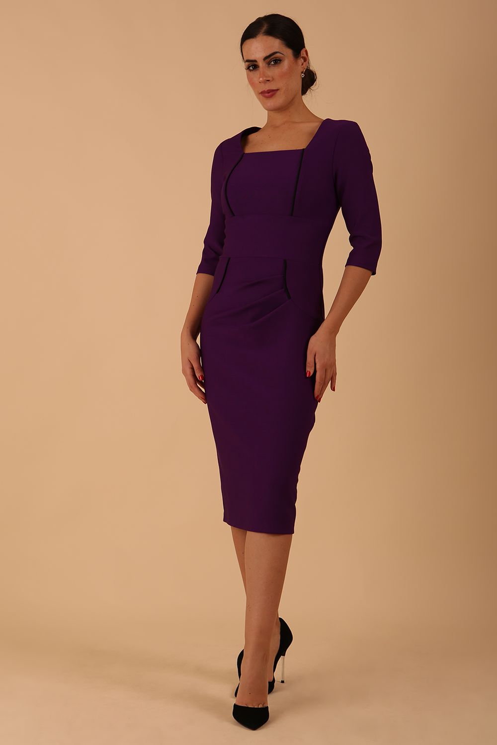 Model wearing diva catwalk Seed Divine Dress 3/4 sleeved knee length in imperial purple colour