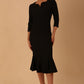 model wearing a diva catwalk Seed Brecon Fishtail Sleeved Dress in black colour