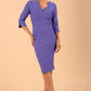 model wearing seed couture zara pencil skirt dress in dawn indigo with asymmetric neckline with sleeves front