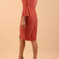 A brunette model is wearing a velvet long bell sleeve pencil dress maternity style in mahogany pink colour back