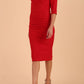 model wearing seed couture royale pencil skirt dress with pleating across the tummy area with rounded neckline with a split in the middle and 3 4 sleeve in Salsa Red colour front side
