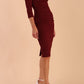 model is wearing diva catwalk polly sleeved pencil dress with low rounded neckline at the back in Cabaret Burgundy side