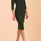 model is wearing diva catwalk polly sleeved pencil dress with low rounded neckline at the back in Deep Green side