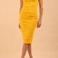 brunette model wearing diva catwalk lydia sleeveless pencil flattering fitted plain dress with split neckline and pleating across the body in spectra yellow front