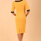 brunette model wearing Diva catwalk goggle pencil dress with short sleeve and v-neckline with contrasted design across body in radiant yellow back