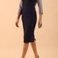 Model wearing Diva catwalk Katykat pencil figure fitted dress in navy blue and steel grey detail with three quarter sleeve front image