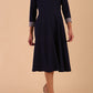 Model wearing Diva catwalk Coralia swing dress in navy / sky grey contrast with three quarter sleeve figure fitted front image