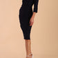 Model is wearing a 3/4 sleeve pencil dress with the keyhole details in navy