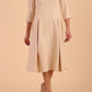 model is wearing diva catwalk harpsden a-line skirt 3/4 sleeve swing dress with rounded neckline in sandshell beige front