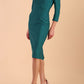 Model wearing diva catwalk Cyrus 3/4 Sleeve Pencil skirt Dress in Pacific Green side