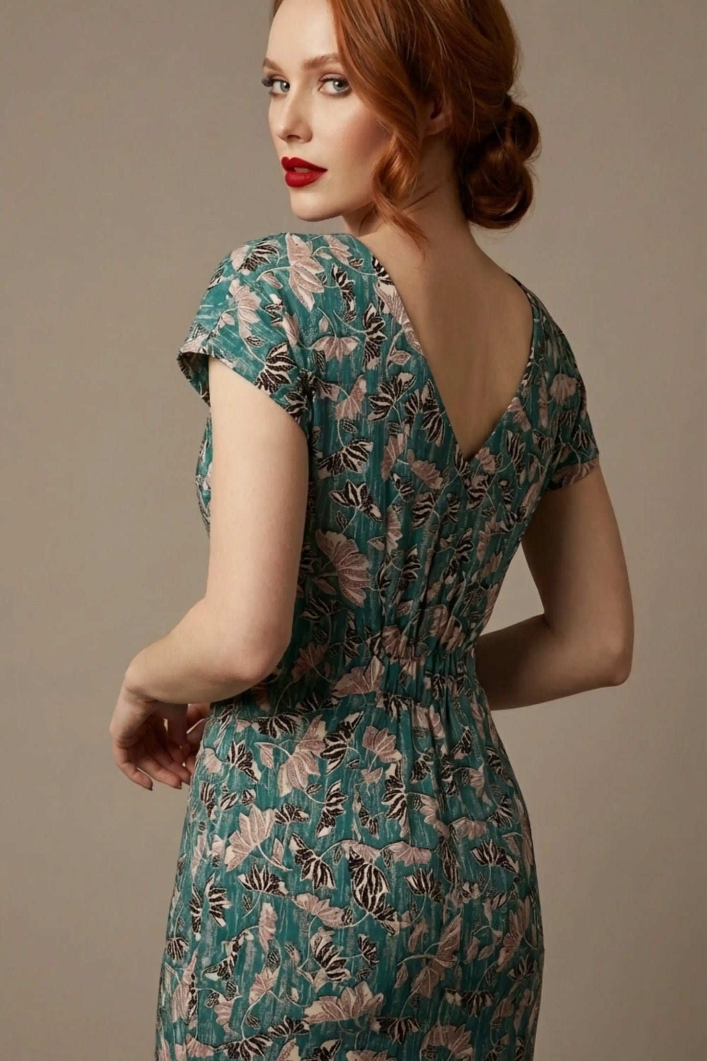 Woman wearing a diva catwalk Magritte Vintage Floral Cotton Pencil Dress, floral dress against a plain background (Vintage Floral Print)