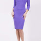 Model wearing the Diva Chelsea Pencil dress with V neckline and three-quarter sleeves in opulent violet front image