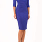 model is wearing diva catwalk seed axford pencil sleeved dress with rounded folded collar in palace blue front
