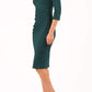 model is wearing diva catwalk eliza sleeved pencil dress with collared v-neck in forest green front