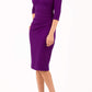 brinette model wearing diva catwalk kubrick pencil-skirt dress with sleeves and asymmetric neckline in deep purple front
