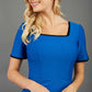 blonde model wearing seed albany contrasted pencil-skirt dress with short sleeves and pleating across the tummy with low square neckline and contrasted detail finishing in sapphire blue front