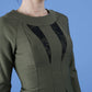 model wearing seed bertie dress with sleeves and rounded neckline with lace details pointing towards the band in olive green front