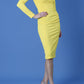 model is wearing diva catwalk cynthia long sleeve pencil dress with low v-neckline in freesia yellow front