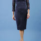 model is wearing diva catwalk bucklebury lace dress with sleeved and low neckline in navy blue front
