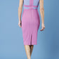model is wearing duva catwalk banbury sleeveless colour block pencil dress with low v-neck in rosebud pink and vista blue back