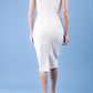 model is wearing diva catwalk seed cadiz pencil sleeveless dress in sandy cream back
