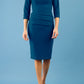 Model wearing the Diva Daphne ¾ Sleeved dress with pleat detail across the hips and ¾ sleeve length in glorious teal front