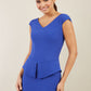 Model wearing the Diva Azalea Peplum dress with semi V neckline and peplum waistline in riviera blue front image
