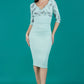 Model wearing the Diva Cynthia Print Contrast dress with pleating across the front in deco green fern front image