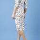 Model wearing the Diva Cynthia Floral Print dress with pleating across the front in linear tulip print back