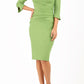 blonde model wearing seed tuscany pencil fitted dress in citrus green colour with a split in the neckline and split detail on sleeves front