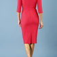 model is wearing diva catwalk seed axford pencil sleeved dress with rounded folded collar in opera pink back