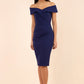 brunette model wearing diva catwalk evening pencil skirt dress sleeveless with lowered neckline and pleating on side in navy blue colour front