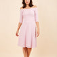 brunette model is wearing diva catwalk off shulder swing a-line islay dress with sleeves in dawn pink front