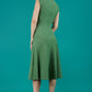 model wearing diva catwalk rochelle swing skirt a line dress without sleeves with a low v neck in vineyard green front
