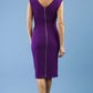 model is wearing Sleeveless marvel stretch Diva Roseberry pencil dress in deep purple back