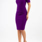 Model wearing the Diva Camille Marvel, pleat detail across front, fold at neckline in deep purple front imagemodel is wearing diva catwalk camille short sleeve pencil dress with folded rounded neckline in purple front