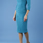 model is wearing diva catwalk polly sleeved pencil dress with low rounded neckline at the back in mosaic blue front