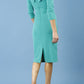 model is wearing diva catwalk eliza sleeved pencil dress with collared v-neck in emerald Green back
