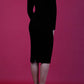 blonde model wearing diva catwalk black pencil dress called trocadero pencil midaxi style with funnel neckline and lace detail and long sleeves back
