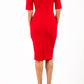 Model wearing Diva catwalk Derwent Pencil skirt dress with shoulder pads and short sleeves and pockets on both sides and empire waistline in true red back