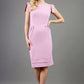 Model wearing the Diva Branwell Pencil dress with tie on shoulders in dawn pink front image